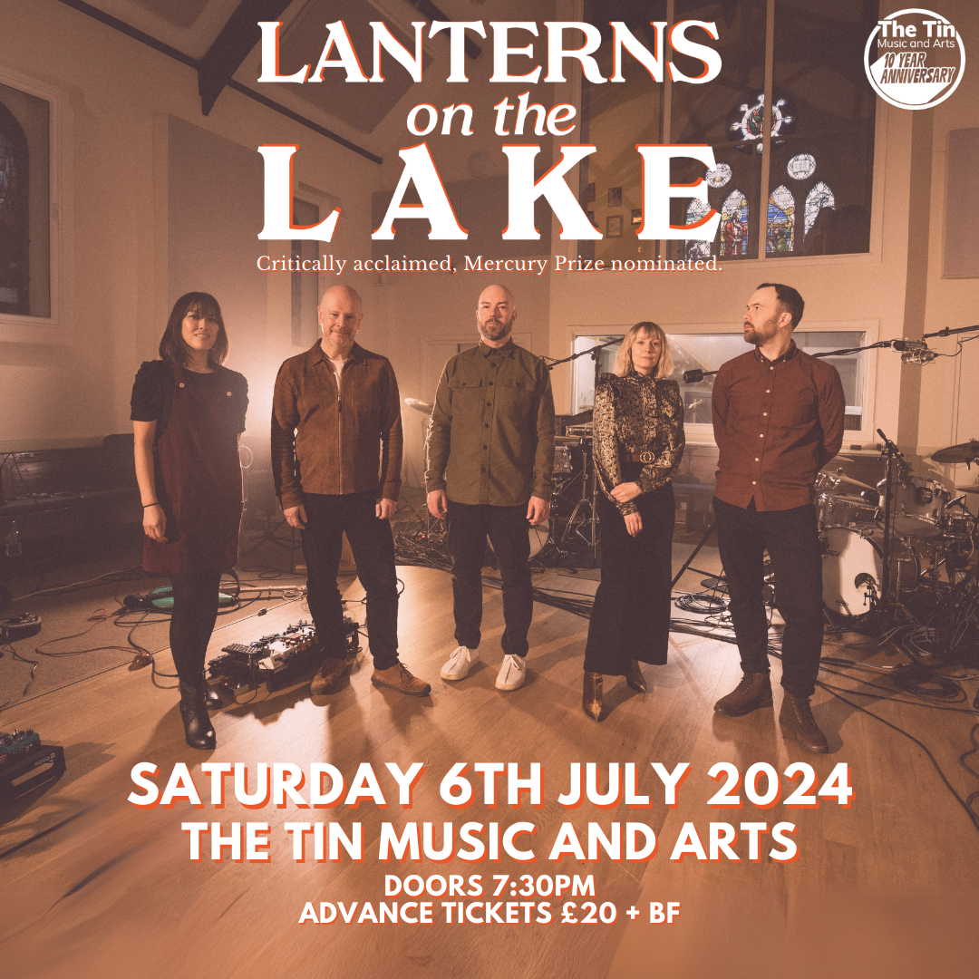 Poster for Lanterns on the Lake's performance at The Tin Music and Arts on Saturday 6th July 2024. Poster image is of five people standing in a recording studio with a wooden floor.